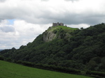 SX16158 Carreg Cennen Castle on top of distant cliffs.jpg